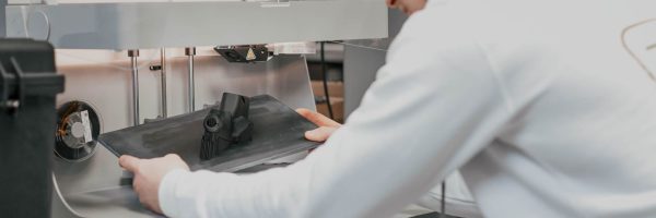 Person taking a print easely of a printer